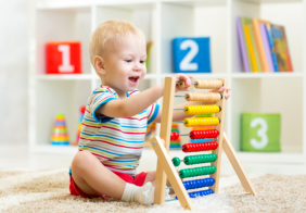 infant playing with toy